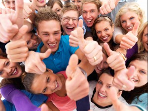 Top view portrait of men and women standing together and showing thumbsup sign